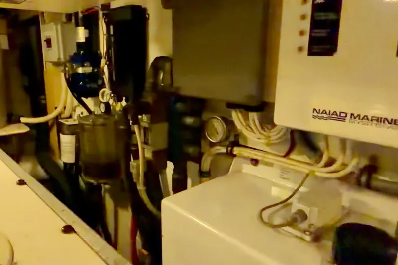 Chasing Sunsets Yacht Photos Pics Engine room of 2000 Pacific Mariner 65 Motoryacht with Naiad Marine Systems equipment.
