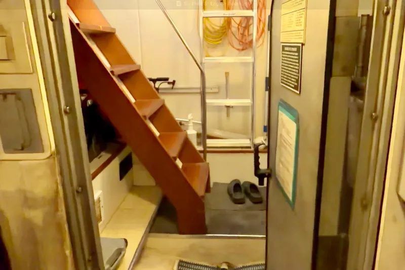 Chasing Sunsets Yacht Photos Pics Interior of 2000 Pacific Mariner 65 Motoryacht with wooden stairs and equipment.