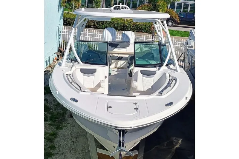 317-125 Yacht Photos Pics 2024 Robalo R317 Dual Console boat, white exterior, docked, front view.