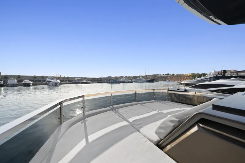 Explocean 3 Yacht Photos Pics Luxury Explorer 62 yacht deck overlooking marina, 2025 model, clear blue sky.