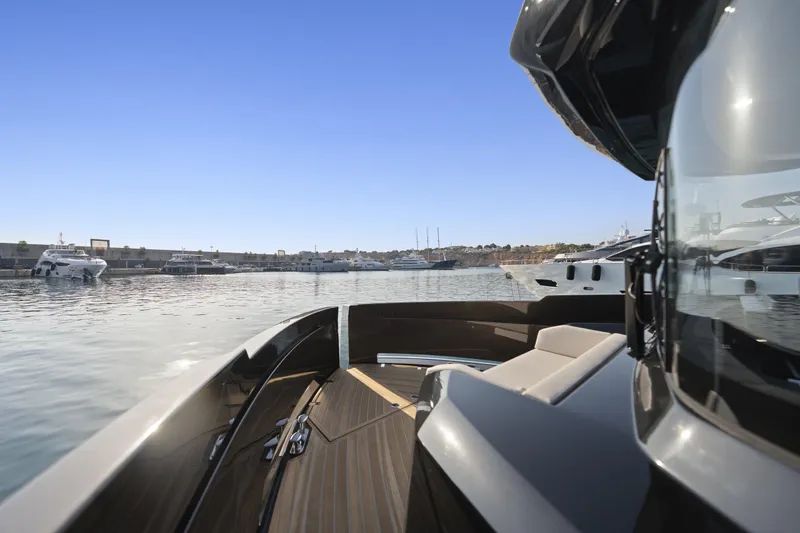 Explocean 3 Yacht Photos Pics 2025 Explorer 62 yacht in marina, sleek design, clear blue sky, luxury boating experience.