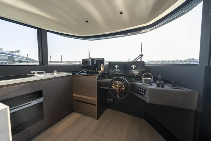 Explocean 3 Yacht Photos Pics Modern helm station of 2025 Explorer 62 yacht with sleek controls and panoramic windows.