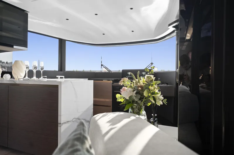 Explocean 3 Yacht Photos Pics Luxurious interior of 2025 Explorer 62 yacht with elegant decor and panoramic windows.