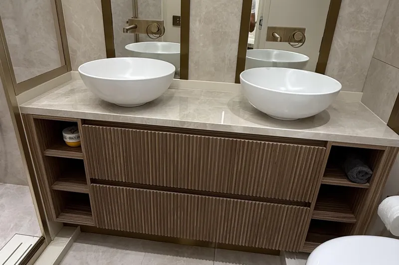 Explocean 3 Yacht Photos Pics Modern bathroom vanity with dual vessel sinks and wooden cabinetry, Explorer 62, 2025 model.