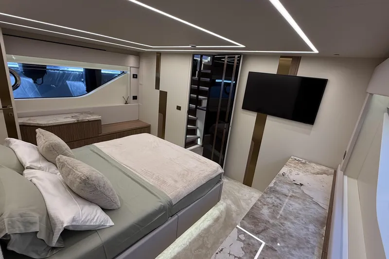 Explocean 3 Yacht Photos Pics Luxurious bedroom interior of 2025 Explorer 62 yacht, featuring modern design and elegant furnishings.