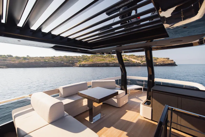 Explocean 3 Yacht Photos Pics Luxurious 2025 Explorer 62 yacht deck with modern seating and scenic ocean view.