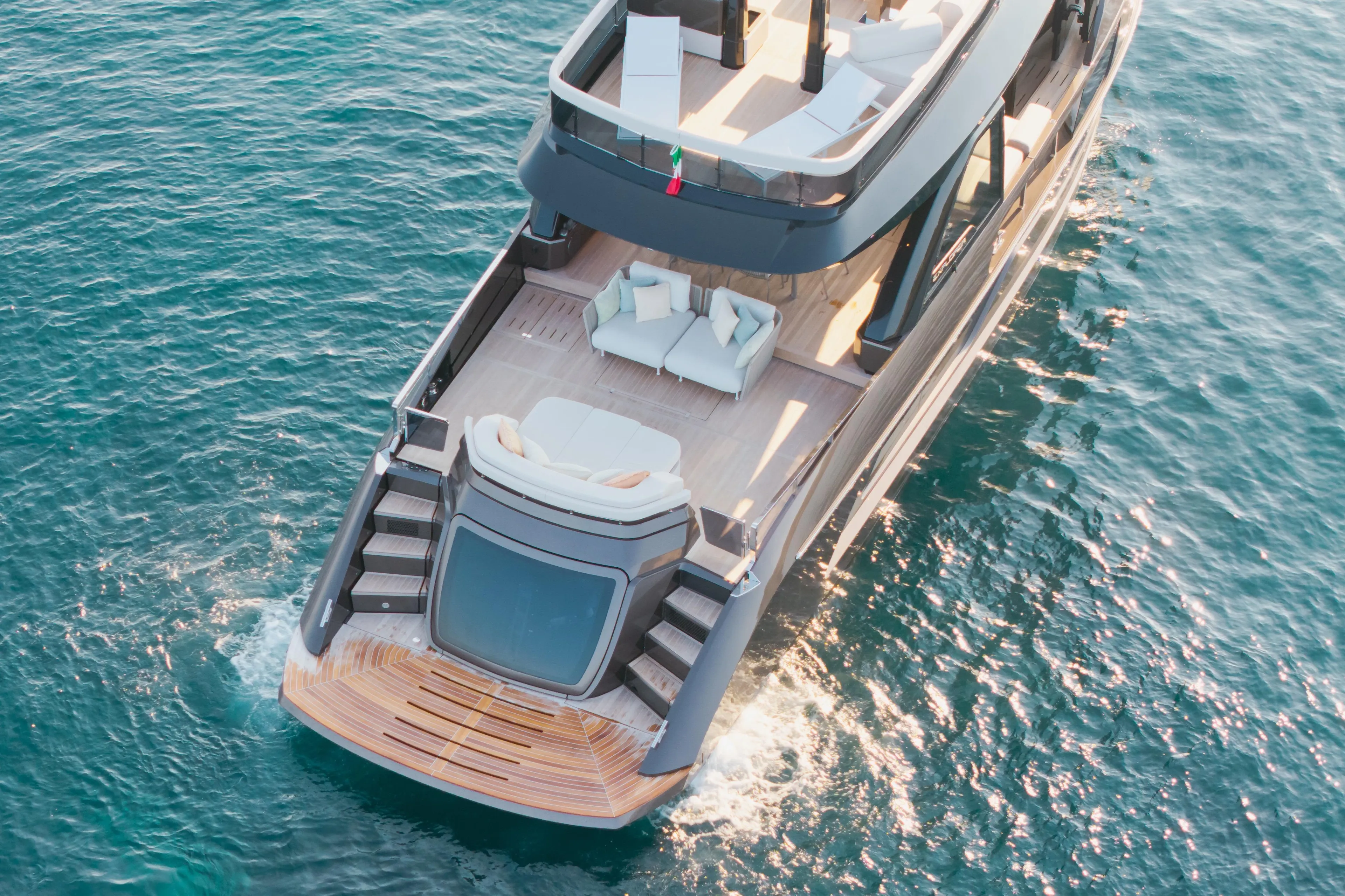 Luxurious 2025 Explorer 62 yacht cruising on clear blue ocean waters.
