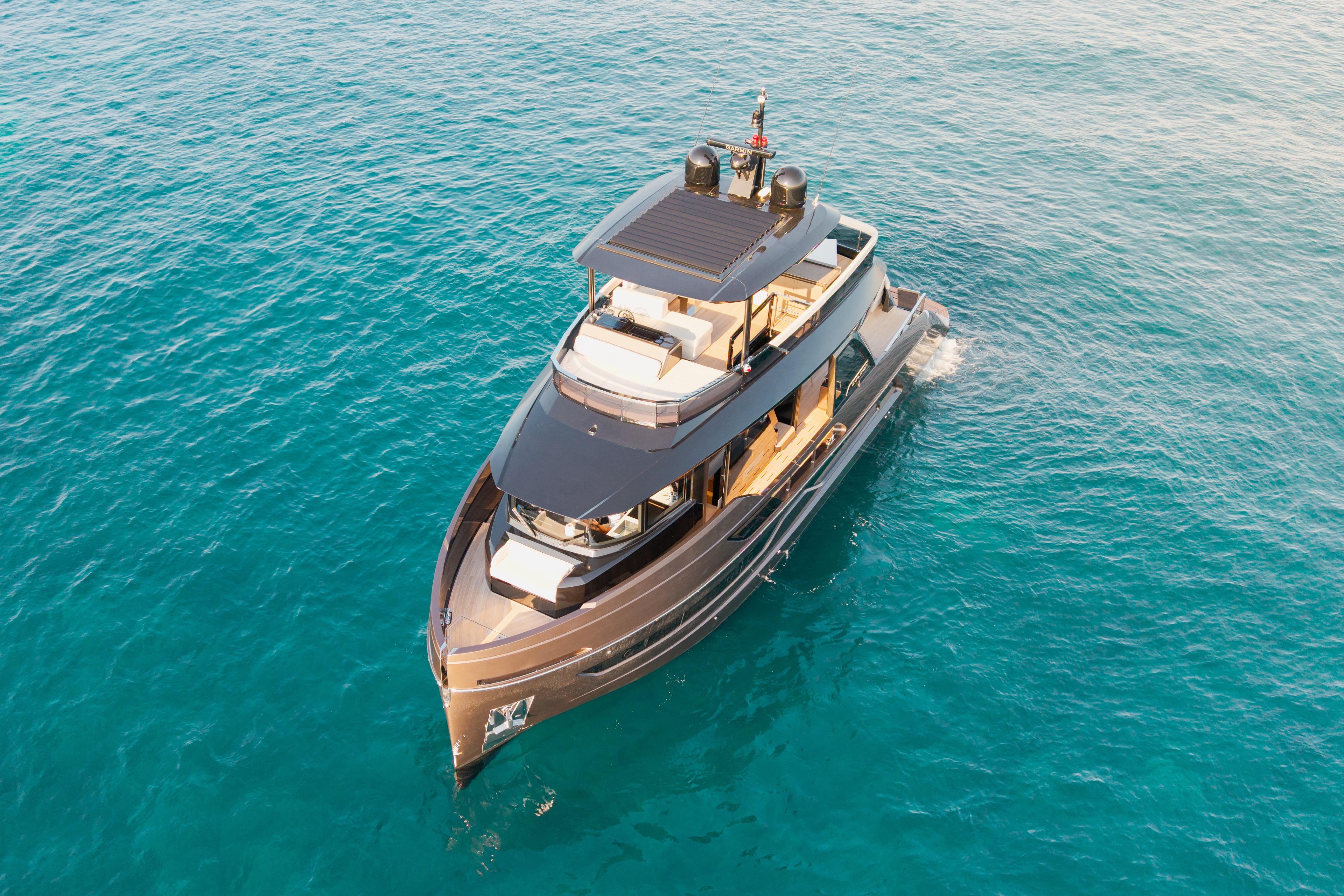 Luxurious 2025 Explorer 62 yacht cruising on clear blue ocean waters.