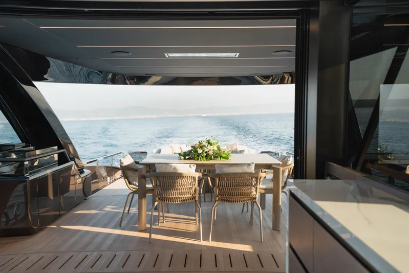 Explocean 3 Yacht Photos Pics Luxurious Explorer 62 yacht interior, 2025 model, featuring elegant dining area with ocean view.