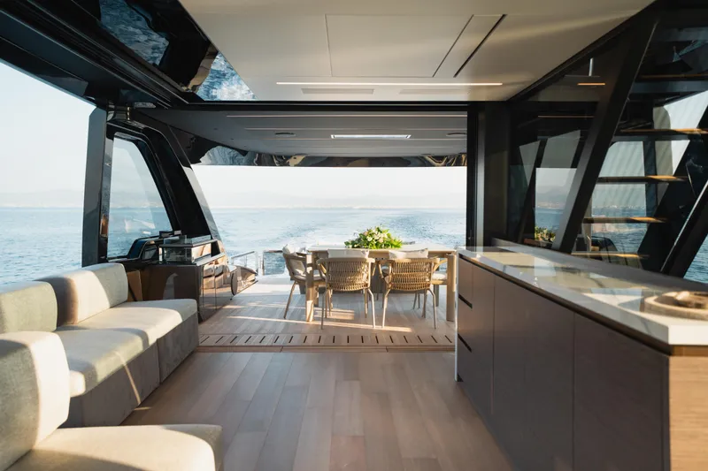 Explocean 3 Yacht Photos Pics Luxurious interior of 2025 Explorer 62 yacht with ocean view and elegant furnishings.