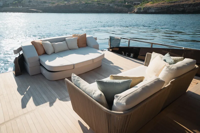Explocean 3 Yacht Photos Pics Luxurious 2025 Explorer 62 yacht deck with plush seating overlooking serene waters.