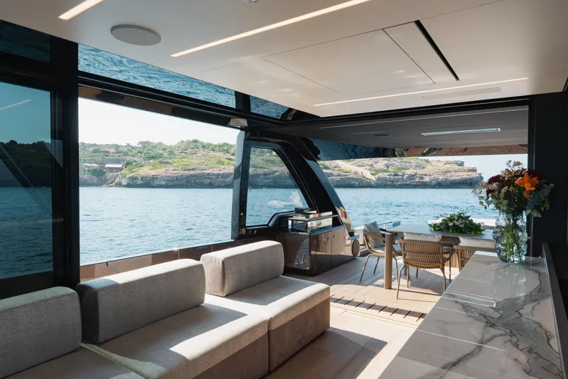Explocean 3 Yacht Photos Pics Luxurious interior of 2025 Explorer 62 yacht with ocean view and elegant furnishings.