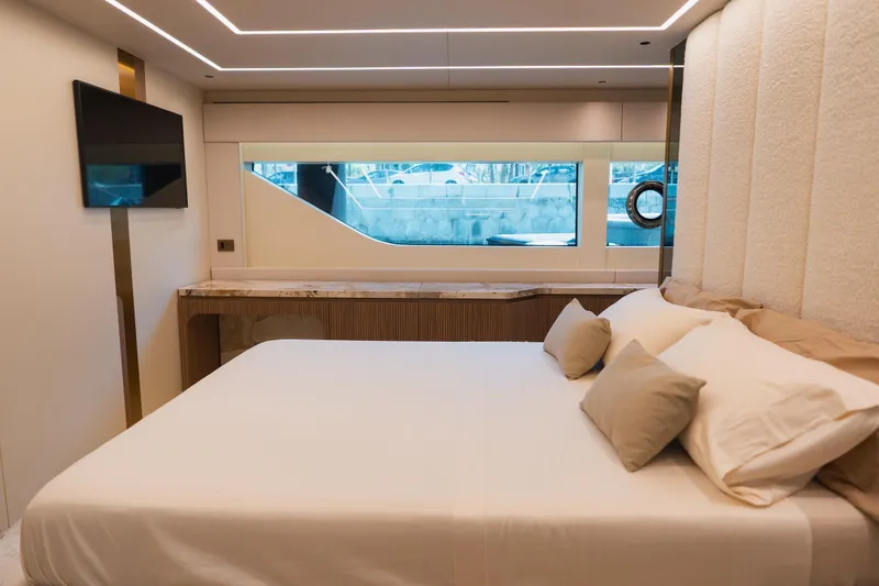 Explocean 3 Yacht Photos Pics Luxurious bedroom interior of 2025 Explorer 62 yacht with modern design and large window.