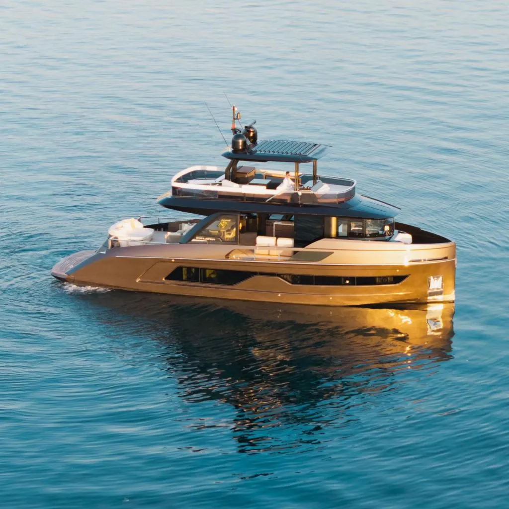Luxurious 2025 Explorer 62 yacht cruising on calm blue waters.
