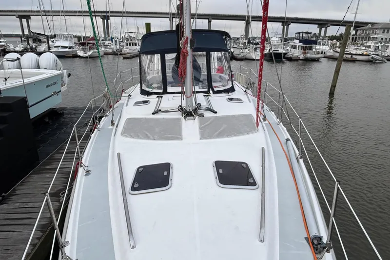 Kraken Yacht Photos Pics Hunter Passage 450 sailboat docked at marina, showcasing deck and cabin, year 2000 model.