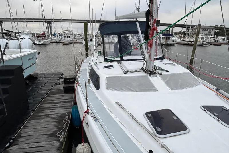 Kraken Yacht Photos Pics Hunter Passage 450 sailboat docked at marina, 2000 model, with overcast sky.