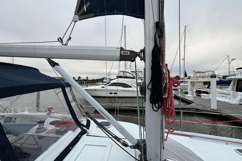 Kraken Yacht Photos Pics Hunter Passage 450 sailboat from 2000 docked at a marina, featuring rigging and sails.