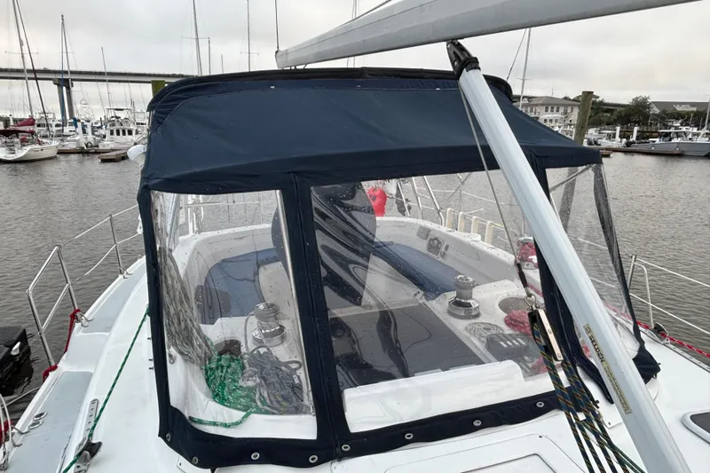 Kraken Yacht Photos Pics Hunter Passage 450 sailboat, 2000 model, docked with blue canopy and visible cockpit.