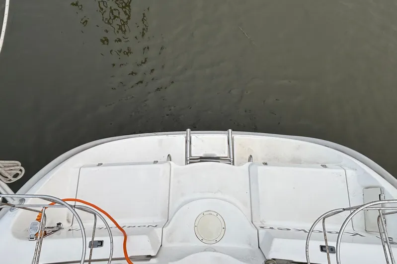 Kraken Yacht Photos Pics Hunter Passage 450 sailboat stern view, showing deck and water, year 2000 model.