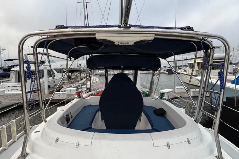 Kraken Yacht Photos Pics Hunter Passage 450 sailboat cockpit, 2000 model, docked at marina with surrounding boats.