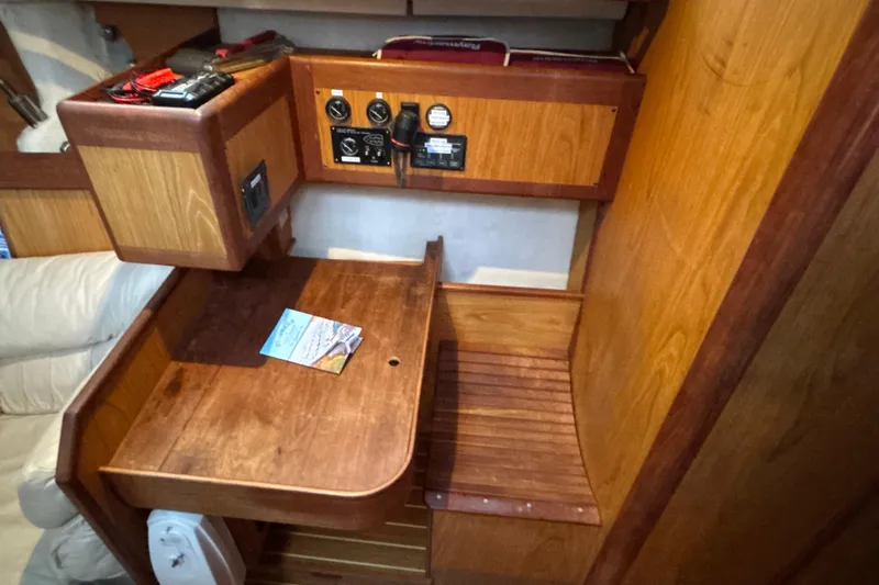 Kraken Yacht Photos Pics Interior of 2000 Hunter Passage 450 sailboat with wooden navigation station.