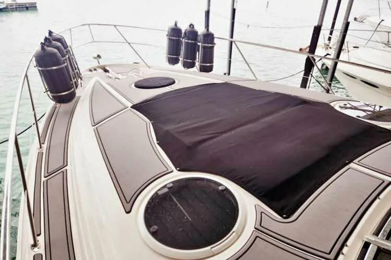  Yacht Photos Pics 2007 Regal Commodore 4460 yacht deck with protective covers and fenders.