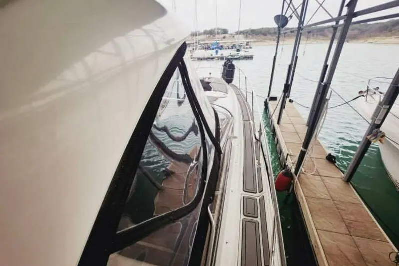  Yacht Photos Pics 2007 Regal Commodore 4460 yacht docked at marina, side view.