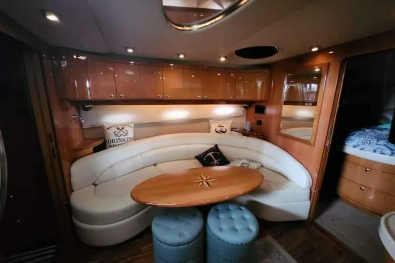  Yacht Photos Pics Luxurious interior of 2007 Regal Commodore 4460 yacht with elegant seating and wooden accents.