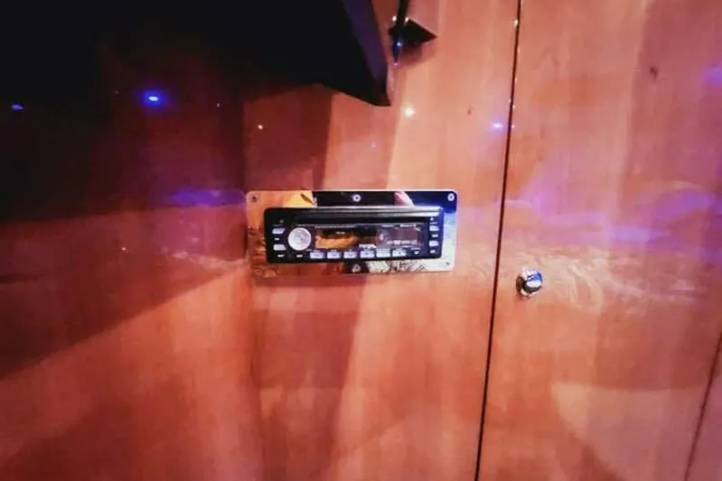  Yacht Photos Pics 2007 Regal Commodore 4460 interior with built-in stereo system on wooden panel.