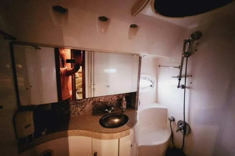  Yacht Photos Pics Luxurious bathroom in 2007 Regal Commodore 4460 yacht with modern fixtures and elegant design.