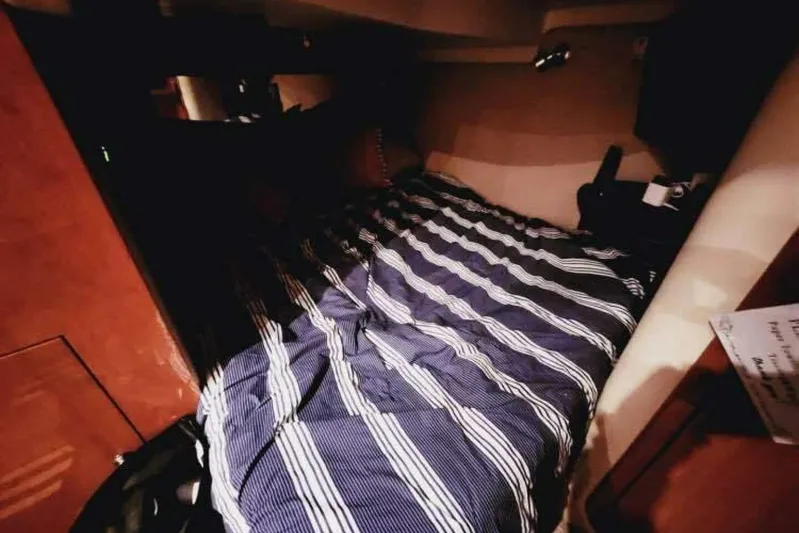  Yacht Photos Pics Cozy cabin interior of 2007 Regal Commodore 4460 with striped bedding.