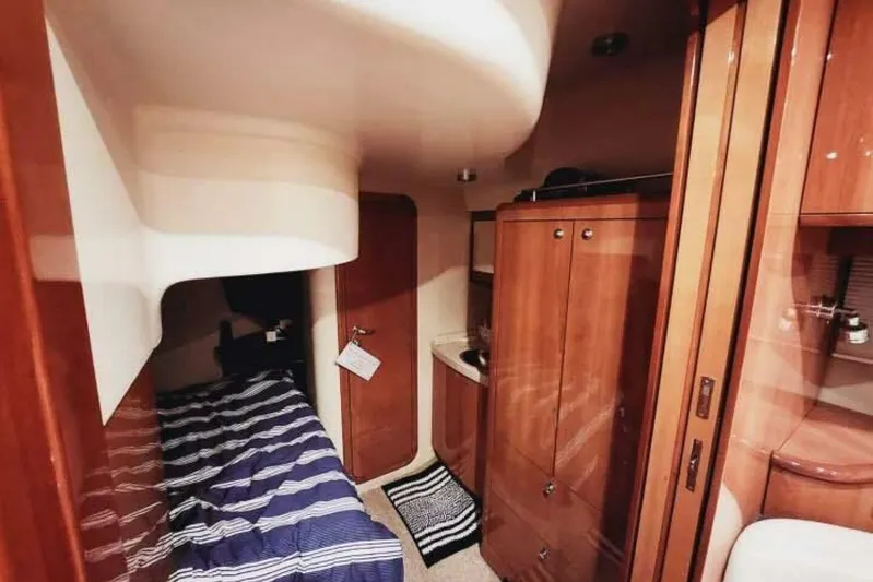  Yacht Photos Pics 2007 Regal Commodore 4460 yacht interior with cozy cabin and wooden cabinetry.