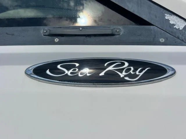 Obsession Yacht Photos Pics Sea Ray logo on 2008 Sea Ray 55 Sundancer yacht, close-up view.