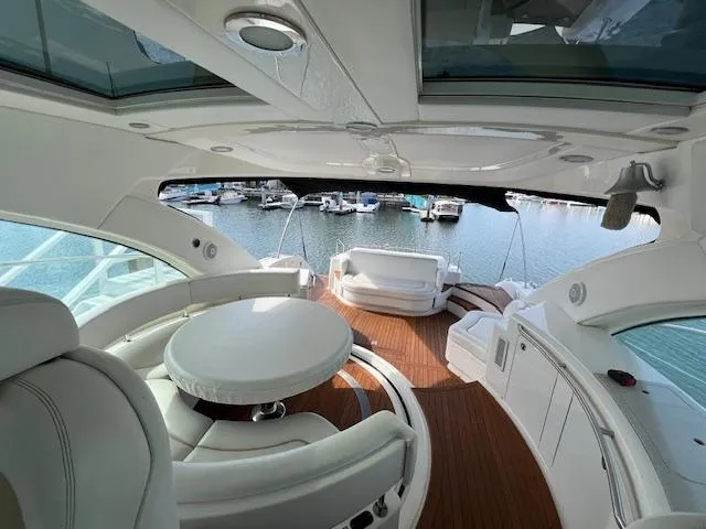 Obsession Yacht Photos Pics Luxurious 2008 Sea Ray 55 Sundancer yacht interior with elegant seating and marina view.