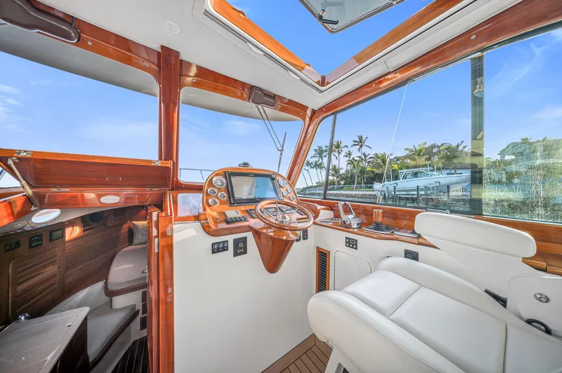 Midnight Yacht Photos Pics Interior of 2014 Hinckley Picnic Boat 37 MKIII with luxurious helm and seating.