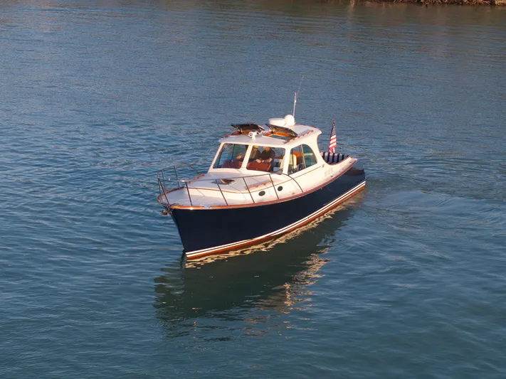 Midnight Yacht Photos Pics 2014 Hinckley Picnic Boat 37 MKIII cruising on calm water.