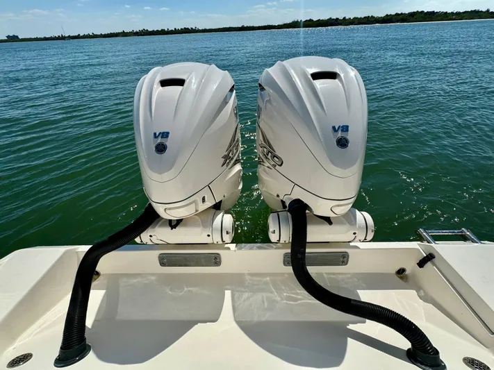  Yacht Photos Pics 2020 Cobia 350 Center Console with twin V8 engines on a calm sea.