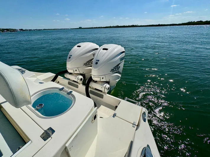  Yacht Photos Pics 2020 Cobia 350 Center Console boat with twin outboard engines on a sunny day.