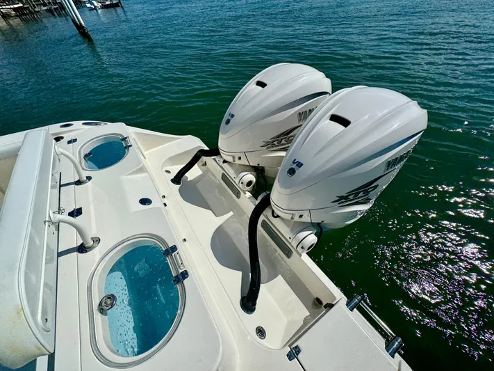  Yacht Photos Pics 2020 Cobia 350 Center Console with twin outboard engines on clear water.