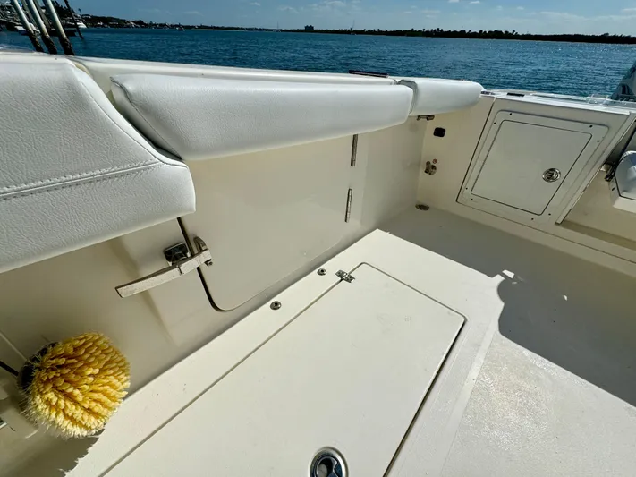  Yacht Photos Pics 2020 Cobia 350 Center Console boat interior with storage compartments and ocean view.