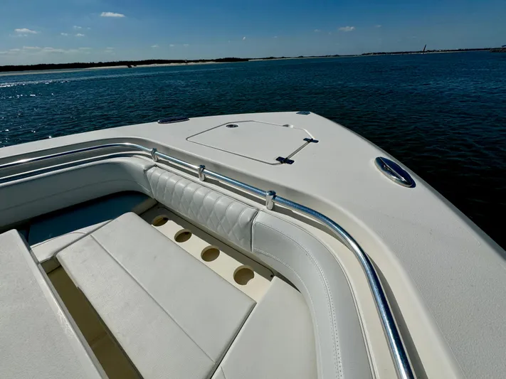  Yacht Photos Pics Cobia 350 Center Console 2020 boat on calm water, featuring spacious seating area.