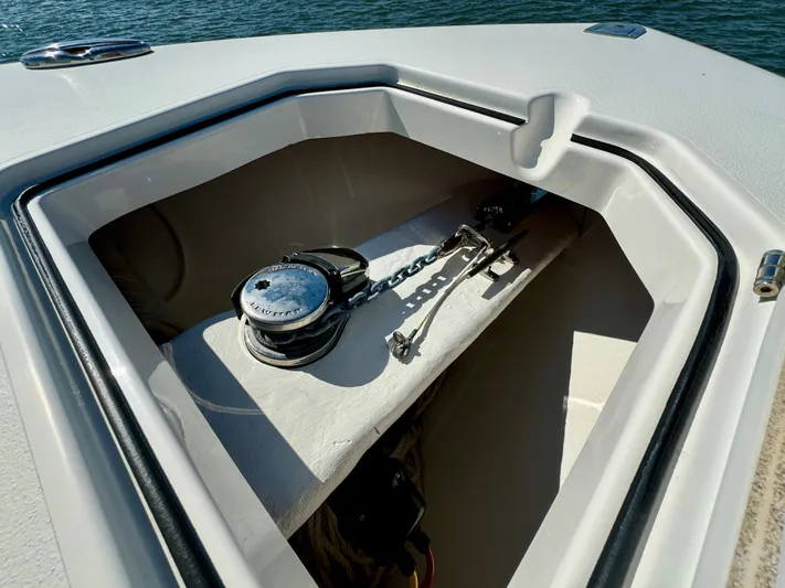  Yacht Photos Pics Anchor compartment of 2020 Cobia 350 Center Console boat, open on calm water.