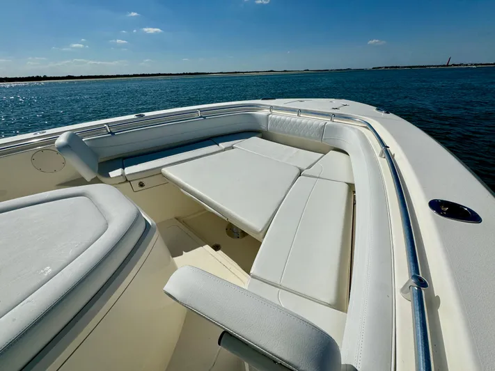 Yacht Photos Pics 2020 Cobia 350 Center Console boat with spacious seating on calm water.