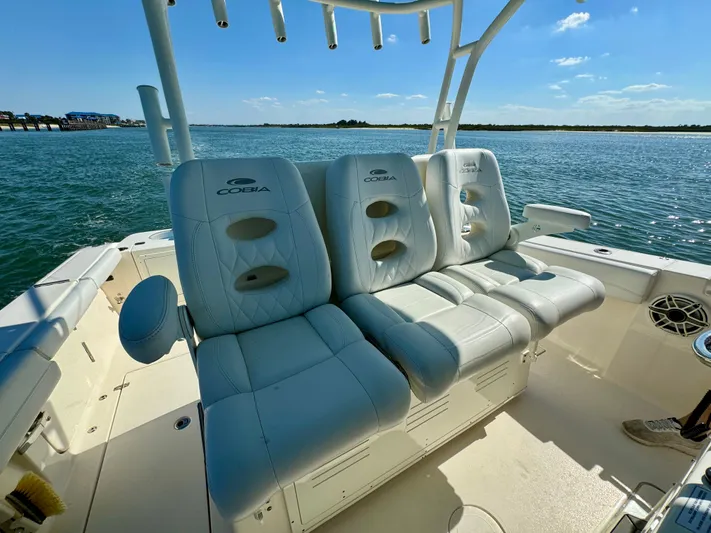  Yacht Photos Pics 2020 Cobia 350 Center Console boat with luxurious white seating, ocean backdrop.