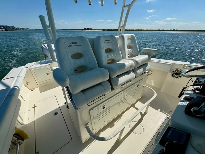  Yacht Photos Pics 2020 Cobia 350 Center Console boat interior with plush seating on a sunny day.