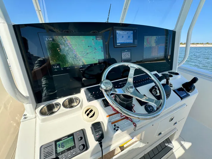  Yacht Photos Pics Cobia 350 Center Console 2020 helm with navigation screens and steering wheel.