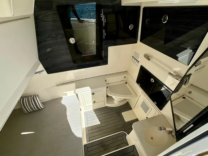  Yacht Photos Pics 2020 Cobia 350 Center Console cabin interior with modern amenities and sleek design.