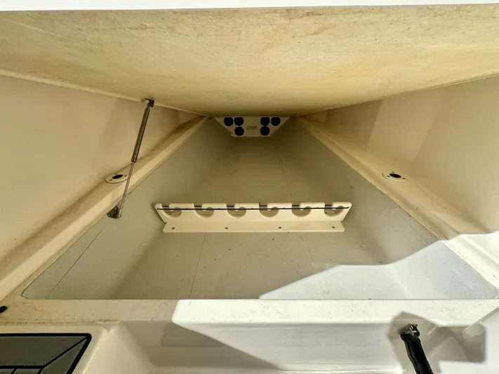  Yacht Photos Pics Storage compartment of 2020 Cobia 350 Center Console boat, featuring organized interior space.