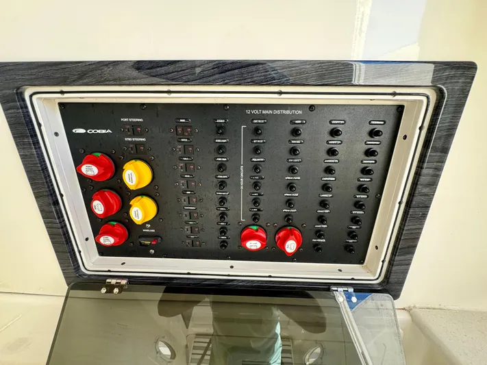  Yacht Photos Pics Control panel of a 2020 Cobia 350 Center Console boat with switches and dials.