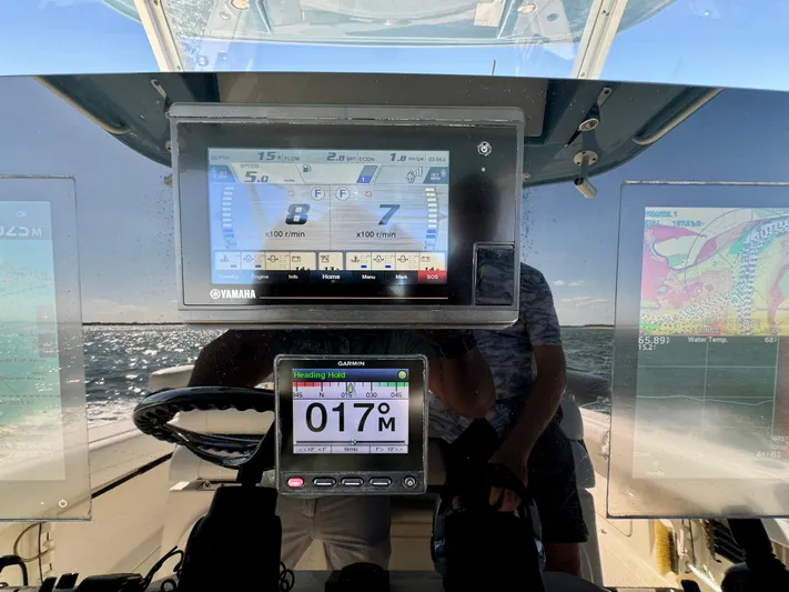  Yacht Photos Pics Dashboard of a 2020 Cobia 350 Center Console boat with navigation displays.